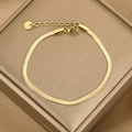 Flat lay of gold stainless steel snake chain bracelet with heart charm on jewelry box - Gold Minimalist Flat Chain (BR-34)
