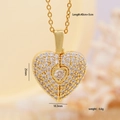 Golden heart wing necklace with clear cubic zirconia in a detailed close-up shot - Main Stone Pavé Heart / Gold