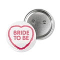 White tinplate Bride To Be badge with pink heart frame showing front and metal pin back - White Background Bride To Be