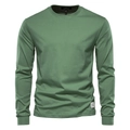 Detail of sage green cotton t-shirt showing round neckline and premium knitted texture - Green