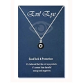 Detail of evil eye amulet necklace on a blue card with good luck protection message - Steel Color Black Bead (Black Eye)