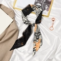 French bow hair ribbon with orange horse print and black-white geometric patterns - Space Horse Beige Black