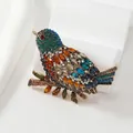 Spilla vintage a uccellino dorata con strass colorati su un ramoscello - Piccolo / Champagne