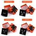 Orange Schmuckschachteln in vier Größen mit schwarzen Schleifen und Schaumstoff - 5x5x3.5cm / Orange / Schwarzes Band