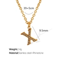 Elegant gold titanium steel necklace featuring letter X pendant with sparkling rhinestones - Letter X