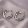 Silver multi-layered intertwined C-shaped hoop earrings on elegant silk background - Multi-Layer Entwined Earrings (E-052) / Platinum