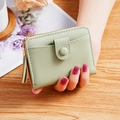 Mint green women's short wallet with pebble leather texture and decorative fringe tassel - Light Green