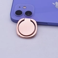 Close-up of rose gold metal phone ring holder attached to a purple smartphone case - Smooth Rose Gold