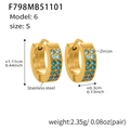 Detail view of U-shaped gold earrings with blue zircon inlays and stainless steel finish - Blue Zirconia Earrings - Small