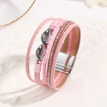 Detail of pink multilayer leather bracelet with sparkling crystals and silver magnetic clasp - Pink