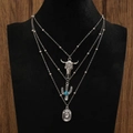 Close-up of layered western necklace with vintage bull head and turquoise cactus pendants - Bull/Turquoise Cactus/Oval Style (A-368) / Antique Silver