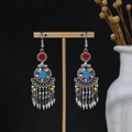 Detailed macro view of Bohemian tassel earrings with colorful beads on a display stand - E4953 Antique Silver Multi