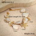 Detail of shell bracelet with golden starfish charms on beach sand, 18+5cm length - New White Shell Bracelet