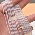 Close-up of 2mm faceted transparent crystal glass rondelle beads for DIY jewelry making - Clear White