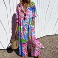 Détail d'une robe longue fleurie colorée avec col boutonné et manches longues - S / Haut Et Bas / Imprimé Floral Patchwork Multicolore