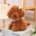 Brown plush teddy dog toy featuring a blue plaid scarf and blue bow on its head - 25cm / Brown