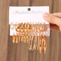 Golden geometric earring set with pearls and hoops displayed on a jewelry card - 05 KC Gold