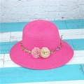 Detail showing pink woven straw sun hat with decorative floral wreath and roses - M (56-58cm) / Rose Red