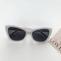 Retro cat-eye sunglasses with white frame and dark grey lenses for street style - Porcelain White