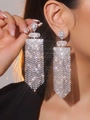 Luxury silver tassel drop earrings with sparkling rhinestones worn by a model - Silver Full Rhinestone Long Dangle