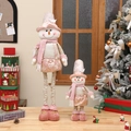 Pink and gold telescopic plush snowman figurines set in a festive Christmas home setting - Small Telescopic Snowman