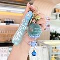 Blue floating liquid bubble keychain with cute whale charm and silicone strap - Oil-filled Flower - Blue