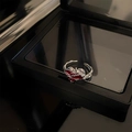 Elegant silver vine ring with red heart gemstone displayed in a sleek black gift box - Foil Heart Style (锡纸爱心戒指)