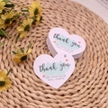 Pink heart-shaped thank you tags for small business on a rustic woven background - Heart Tag No. 1