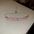 Detail of gold pull-up bracelet with pink pear-cut zircons and clear accent stones - 54# Gold Pink Teardrop Style