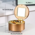 Vintage golden round music jewelry box with internal mirror and red velvet lining - Round Jewelry Music Box - Brown