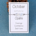 October birthstone bracelet featuring irregular opalite stones on dark grey cord - October/Opalite