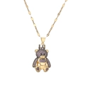 Detailed macro view of the golden crown bear pendant with purple sparkling rhinestones - Purple