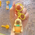 Cute Capybara keychain with orange charm and yellow ring for school bags - Glowing Capybara - Yellow