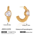 Detailed view of gold stainless steel C-shaped earrings with heart-cut zirconia accents - Heart C-Shaped Earrings (JDE0112259) / Gold