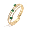 Elegante brazalete dorado multicapa con diamantes transparentes y tres gemas verdes redondas - Estilo B Dorado Circonia Verde Brazalete