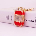 Sparkling red and gold rhinestone suitcase keychain with metal corner accents - Red White