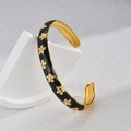 Goudkleurige C-vormige roestvrijstalen armband met zwart emaille en bloemen met diamant - Zwart