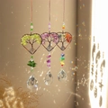 Detailed view of three tree of life heart suncatchers reflecting rainbow light on a wall - 3-Piece Heart Set