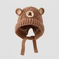 Close-up of brown knitted cotton winter hat with bear ears and chin strap for kids - 3-8 Years / Brown