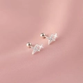 Silver plated double star stud earrings with sparkling crystals on pink silk background - Double Cross Star Screw Back Style