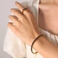 Elegante pulsera tenis de titanio chapado en oro 18K con piedras de circón negro - Negro