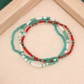 Handmade colorful seed bead bracelets in green, red, and white on a linen background - Style 23-3pcs RGB Set