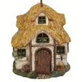 Detailed close-up of a miniature resin thatch cottage with a wood door and white walls - Style 7 European Rural Cottage