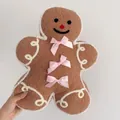 Gingerbread man plush pillow with pink bows and cozy faux shearling texture - Bow Gingerbread Man - Cushion