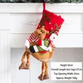 Large festive Christmas stocking with 3D elk and snowman dolls hanging on a white fireplace - Snowman Riding Reindeer Stocking