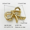 Detailed dimensions of the gold bow hair claw clip with size and weight annotations - No.9 Gold Bow Sized