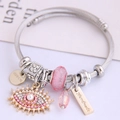 Silver cable charm bracelet with pink glass beads and sparkling Evil Eye pendants - Pink