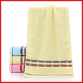 Absorbent cotton towels in yellow, blue, and pink with checkered hem and soft loop texture - Cotton British Plaid Yellow (Towel)