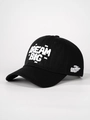 Détail d'une casquette noire avec broderie chenille DREAM BIG blanche de haute qualité - Taille unique / Noir