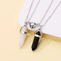 Detail of couple magnetic heart necklace with black and white hexagonal stone pendants - White and Black Stone